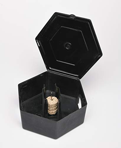Open black hexagonal RatX bait station box showing interior with bait discs loaded on center spike